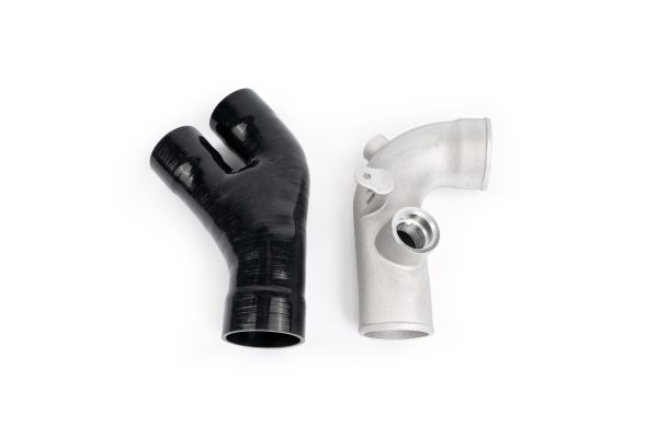 Silicone coupler and cast aluminum intercooler outlet tube with integrated blow off valve mount